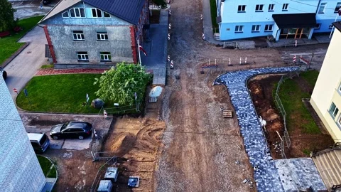 Aerial view of a road construction site with new cobblestone pavement Stock Footage 346597019