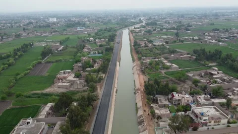 Aerial View of Road Construction on the Stream's Bank Video stock 274473068