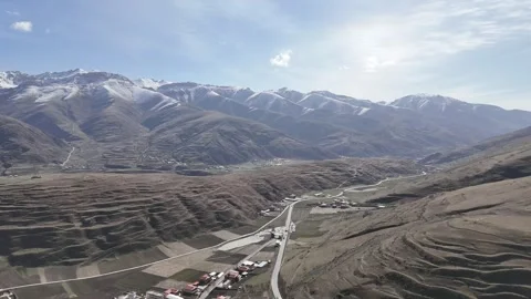 Aerial view of road corridor through remote mountain basin in China Stock Footage 337894280