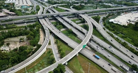 Aerial view of road interchange of highway intersection with cars speeding Stock-Footage 112115463