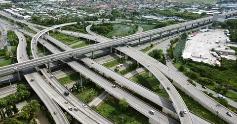 Aerial view of road interchange of highway intersection with traffic speeding Stock Footage 112234898