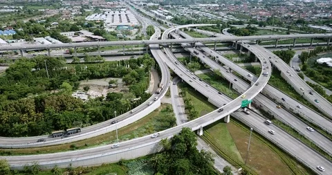 Aerial view of road interchange of highway intersection with traffic speeding Stock Footage 112234968