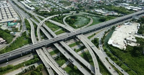 Aerial view of road interchange of highway intersection with traffic speeding Video stock 112237271
