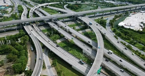 Aerial view of road interchange of highway intersection with traffic speeding Video stock 112237619