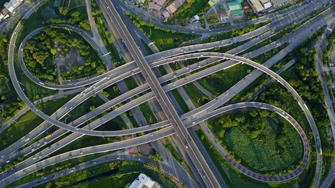 Aerial view of road interchange of highway intersection with traffic speeding Video stock 114802253