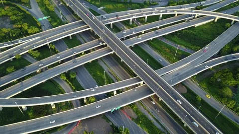 Aerial view of road interchange of highway intersection with traffic speeding Video stock 114807992