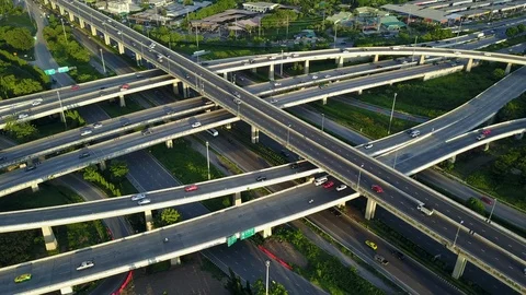Aerial view of road interchange of highway intersection with traffic speeding Video stock 114808272
