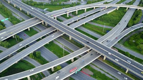 Aerial view of road interchange of highway intersection with traffic speeding 스톡 동영상 114811080
