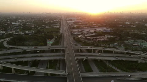 Aerial view of road interchange or highway intersection during sunrise Stock-Footage 146617759