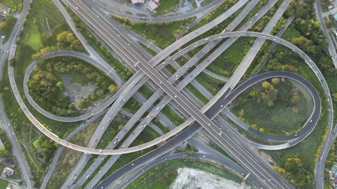 Aerial view of road interchange or highway intersection with cars speeding Stock Footage 146708057