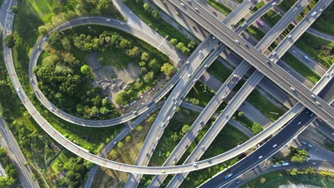 Aerial view of road interchange or highway intersection with cars speeding Video stock 149486002