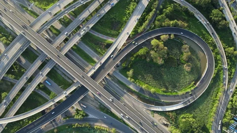 Aerial view of road interchange or highway intersection with cars speeding Stock-Footage 149486250