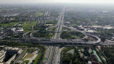 Aerial view of road interchange or highway intersection with cars speeding Video stock 149495922