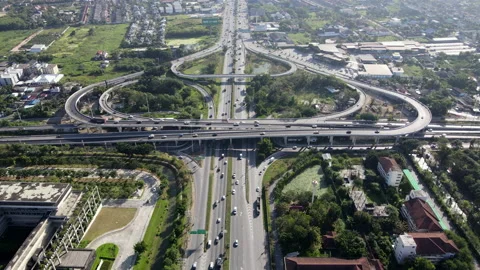 Aerial view of road interchange or highway intersection with cars speeding Video stock 149506519