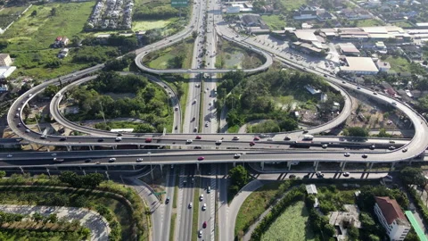Aerial view of road interchange or highway intersection with cars speeding Video stock 149507156
