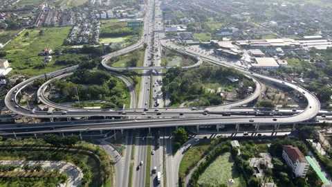 Aerial view of road interchange or highway intersection with cars speeding Video stock 149508397