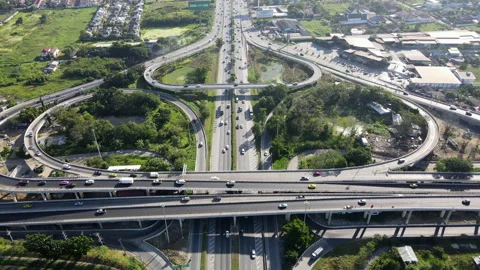 Aerial view of road interchange or highway intersection with cars speeding Stock-Footage 149545695