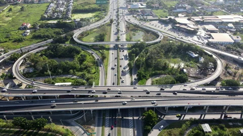 Aerial view of road interchange or highway intersection with cars speeding Video stock 149545699