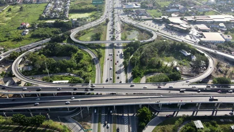 Aerial view of road interchange or highway intersection with cars speeding Video stock 149545731