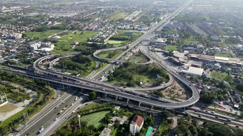Aerial view of road interchange or highway intersection with cars speeding Video stock 149556922