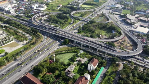 Aerial view of road interchange or highway intersection with cars speeding Video stock 149589201