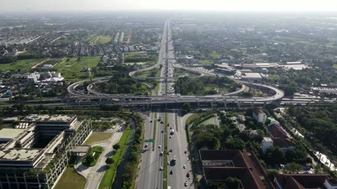 Aerial view of road interchange or highway intersection with cars speeding Video stock 149589204