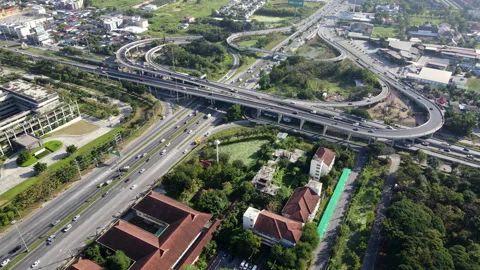 Aerial view of road interchange or highway intersection with cars speeding Video stock 149596653