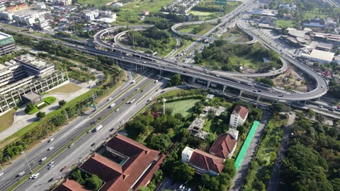 Aerial view of road interchange or highway intersection with cars speeding Video stock 149596655