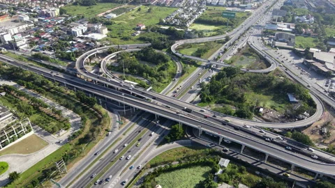 Aerial view of road interchange or highway intersection with cars speeding Video stock 149600267