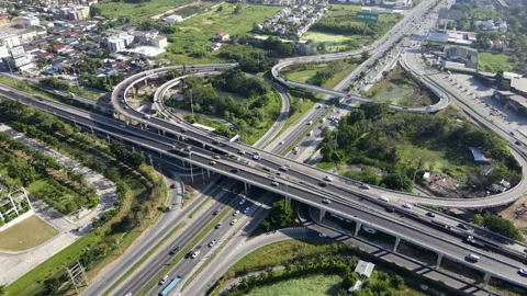 Aerial view of road interchange or highway intersection with cars speeding Video stock 149601153