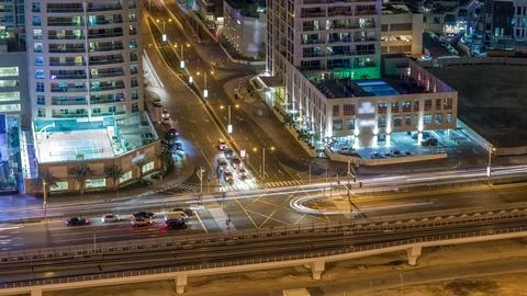 Aerial view of a road intersection in a big city night timelapse. Stock Photos