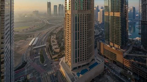 Aerial view of a road intersection in a big city night to day timelapse. Stock Photos
