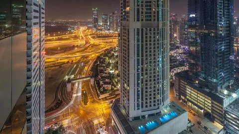 Aerial view of a road intersection in a big city day to night timelapse. Stock Photos
