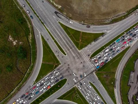 Aerial view of road intersection with crowded vehicles Stock Photos