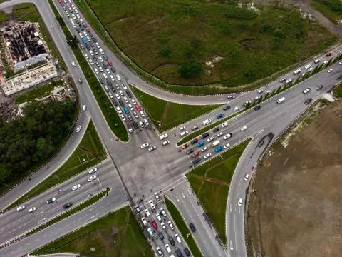 Aerial view of road intersection with crowded vehicles Stock Photos