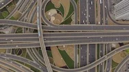 Aerial View Of Road Junction With Moving Cars And Railway Tracks With Train Stock Footage