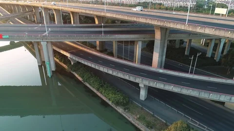Aerial view of road junction with moving cars. Road interchange or highway Video stock 119834061