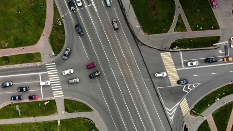 Aerial view of road junction or road intersection in city with cars turning left Stock Footage 112717383