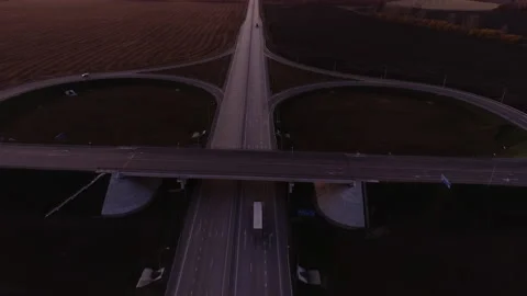 Aerial view. Road junction at sunset. The truck is driving on the highway. Cars Stock-Footage 196817659