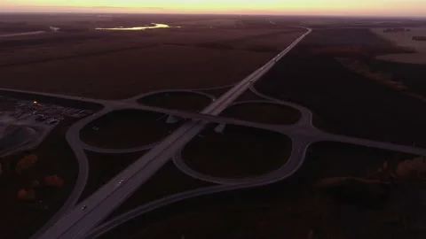 Aerial view. Road junction at sunset. The trucks is driving on the highway. Cars Stock Footage 197028091