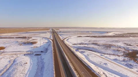 AERIAL:  View of the road junction in winter on a sunny day. Stock Footage 87010084