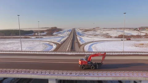 AERIAL:  View of the road junction in winter during sunset. Stock Footage 87010425