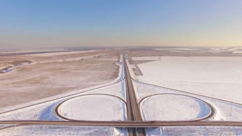 AERIAL:  View of the road junction in winter on a sunny day. Stock Footage 87010807
