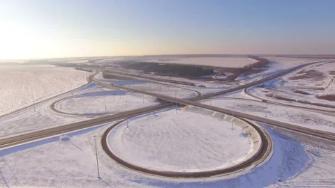 AERIAL:  View of the road junction in winter on a sunny day. Stock Footage 87011152