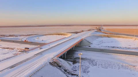 AERIAL:  View of the road junction in winter during sunset. Stock Footage 87012144