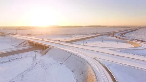 AERIAL:  View of the road junction in winter during sunset. Stock Footage 87013053