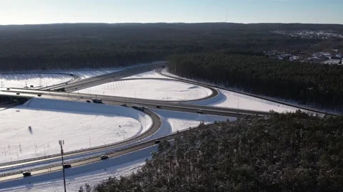 Aerial view of a road junction in a winter landscape. Motorway road junction. 스톡 동영상 301345867