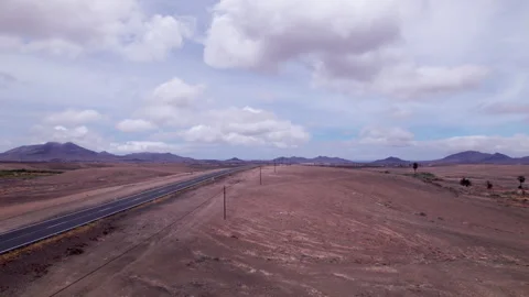 Aerial view of road leading to distant horizon, Fuerteventura Stock Footage 310396739