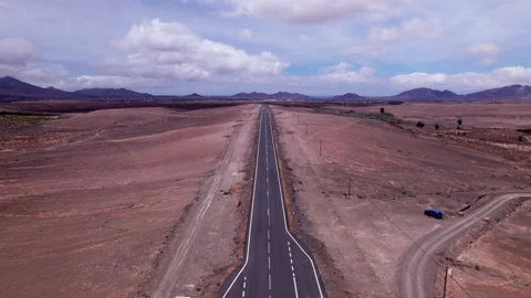 Aerial view of road leading to distant mountains, Fuerteventura Stock Footage 310398181