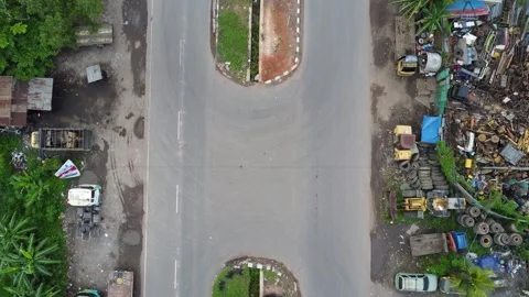 Aerial view of a road lined with trucks parked on the side of the road in a.. Stock Footage 297459239
